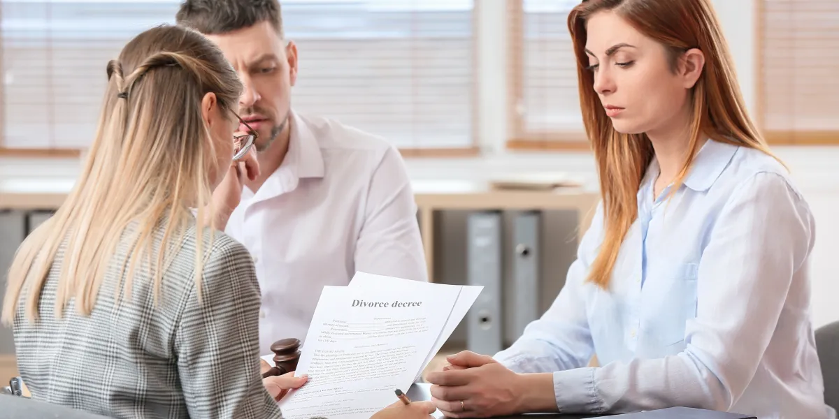 couple signing divorce papers