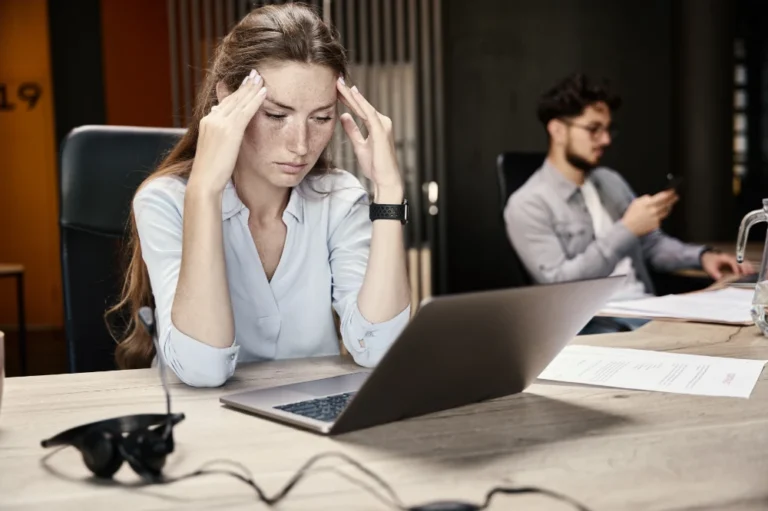 Female employee stressed in an office