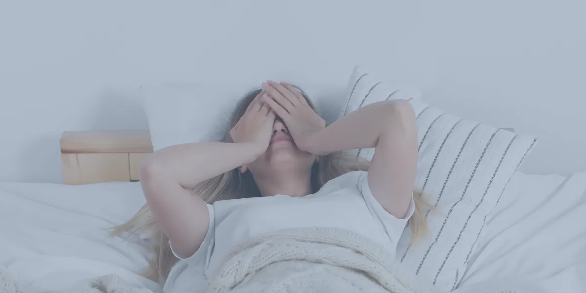 woman not sleeping in her bed due to stress